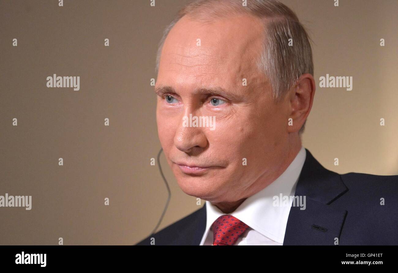 Russian President Vladimir Putin listens to a question during an interview with Bloomberg News September 1, 2016 in Vladivostok, Russia. Stock Photo