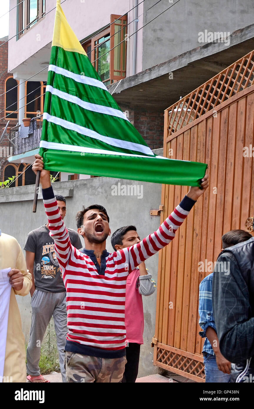 A Kashmiri Protester Raises A Pro Kashmir Flag During Anti India And a-kashmiri-protester-raises-a-pro-kashmir-flag-during-anti-india-and