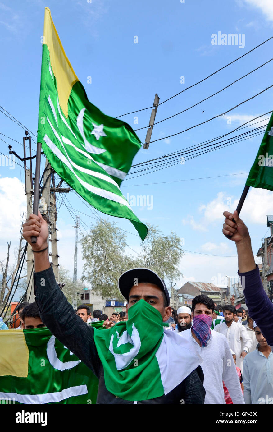 A Kashmiri Protester Raises A Pro Kashmir Flag During Anti India And a-kashmiri-protester-raises-a-pro-kashmir-flag-during-anti-india-and