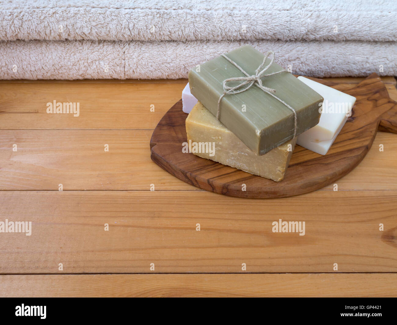 Herbal soap bar tied with jute rope on the olive tree fish shaped