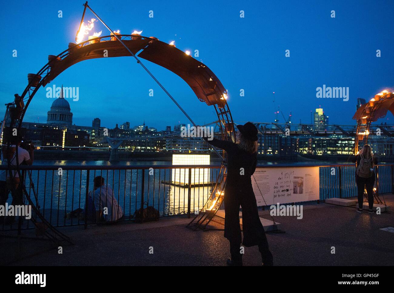 A structure is lit as part of 'Fire Garden' by Compagnie Carabosse, in front of the Tate Modern in London to mark the 350th anniversary of the Great Fire of London. Stock Photo