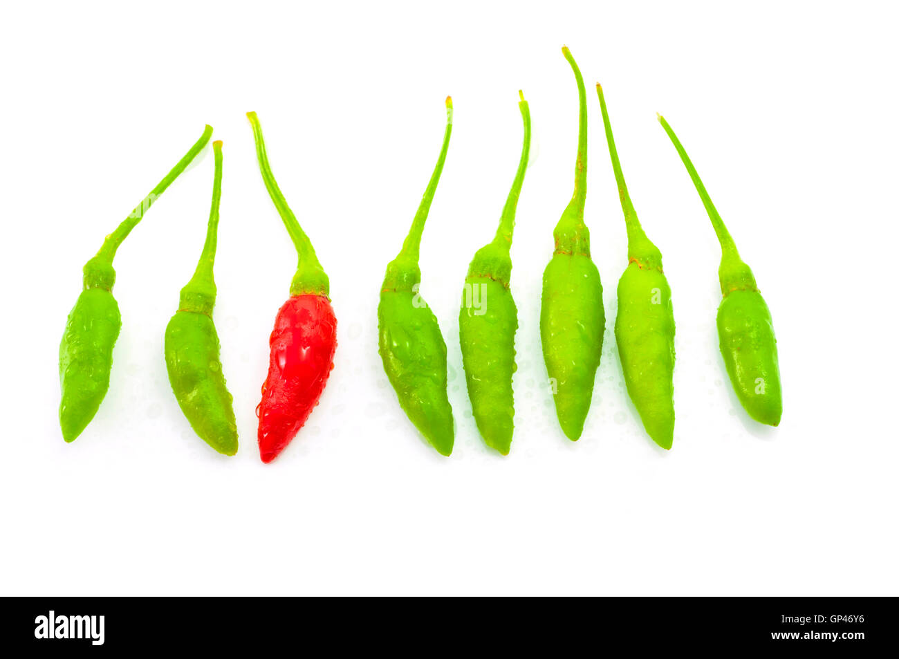 Red chilli among green chilli Stock Photo Alamy