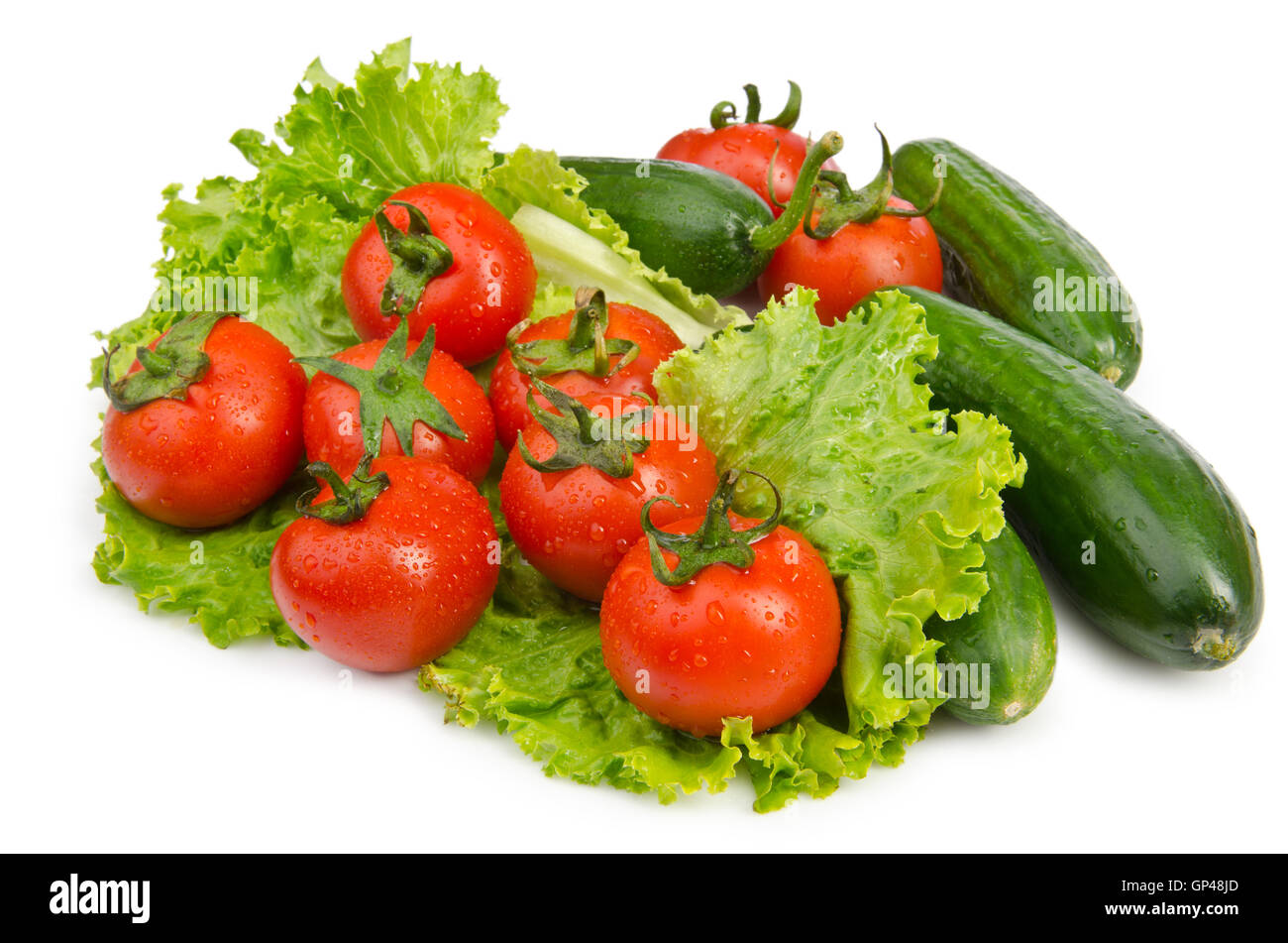 Cucumbers and tomatoes ready for salad Stock Photo - Alamy