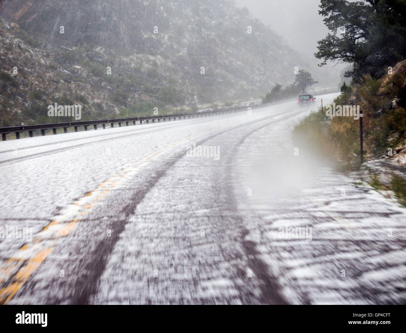 Windshield perspective of a summer hail & rain storm, Big Horn Sheep Canyon, central Colorado, USA Stock Photo