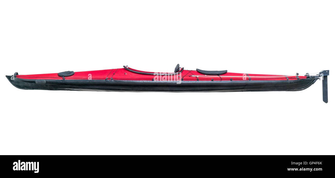 a side view of a folding sea kayak with a red deck and rudder isolated on white Stock Photo