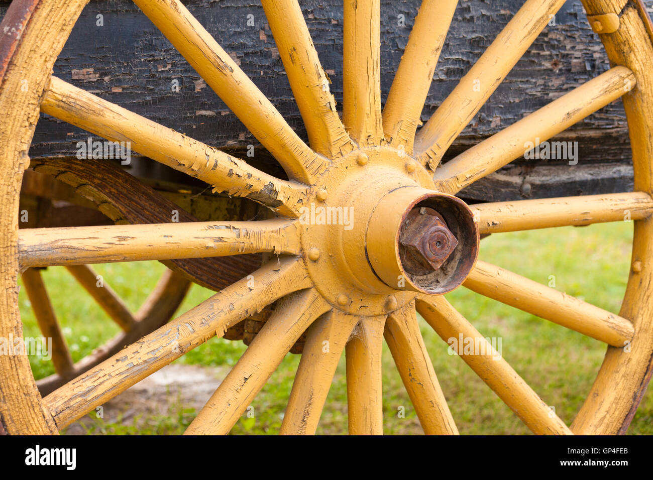 Old painted yellow wagon wheel on historic cart Stock Photo Alamy