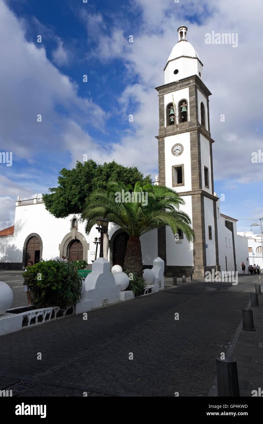 Church of San Ginés originally built 1574, tree shaded park in front. Stock Photo