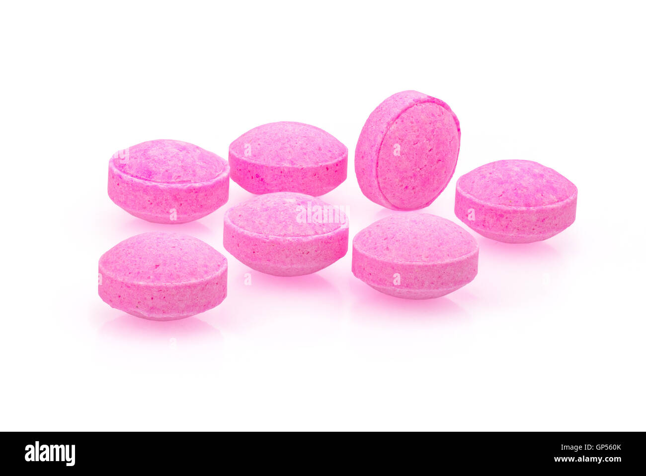 Pink small pills close up macro photography drug on white background4