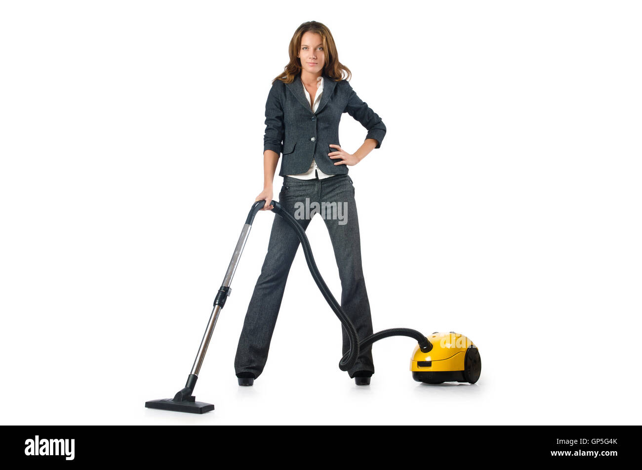 Businesswoman cleaning with vacuum cleaner Stock Photo Alamy