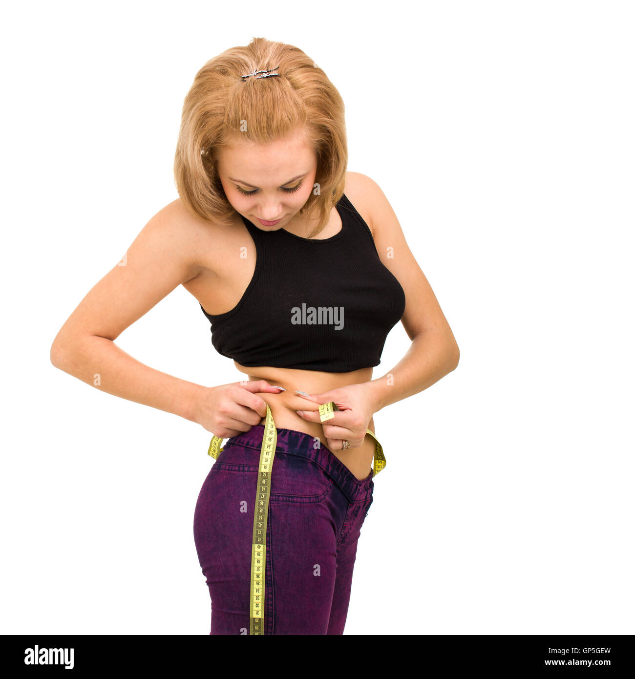  Beautiful young woman measuring her waist Stock Photo - Alamy