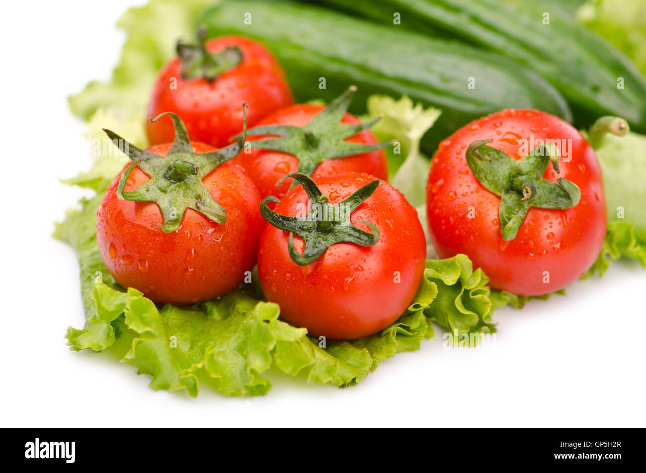 Cucumbers and tomatoes ready for salad Stock Photo - Alamy