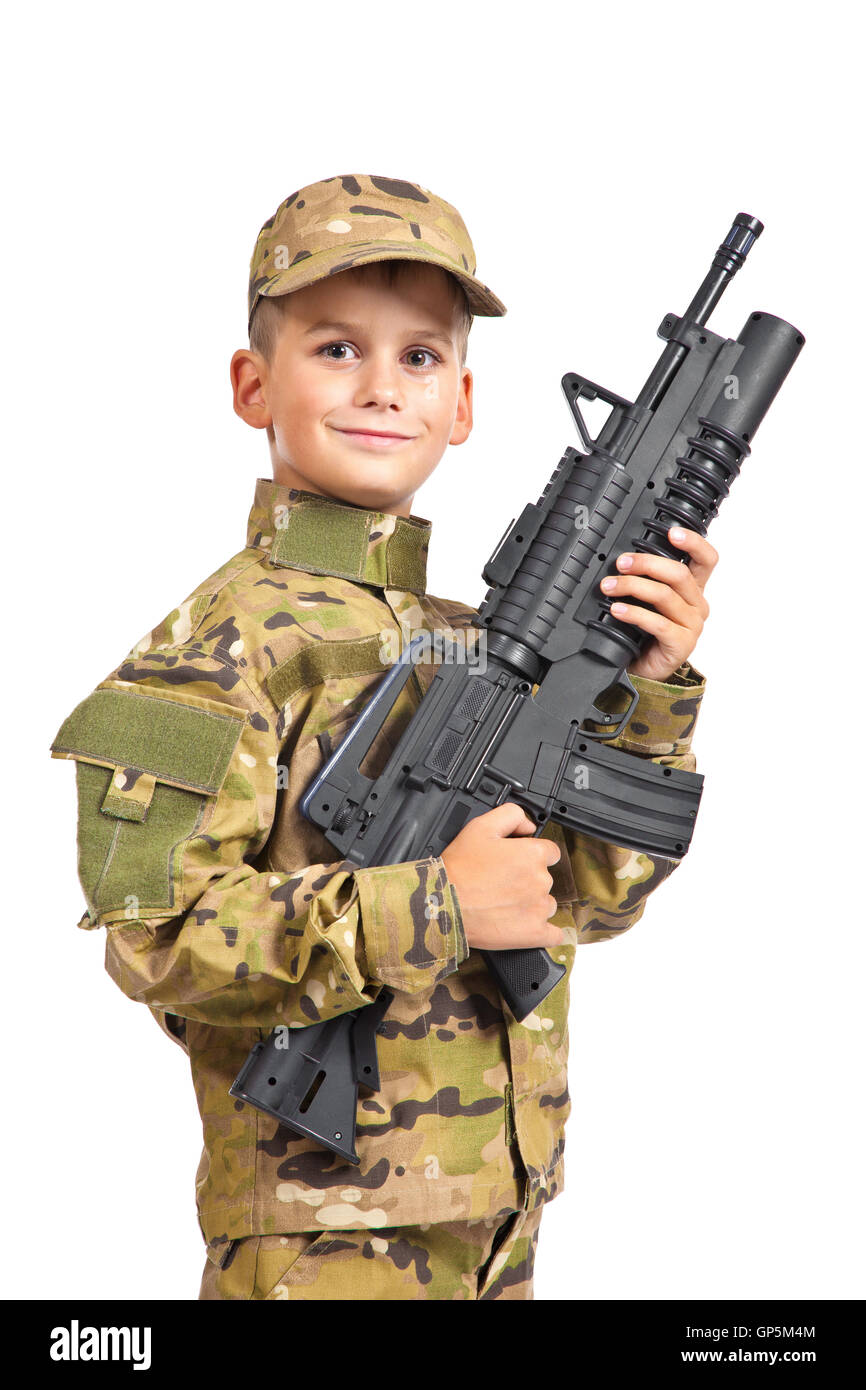 Young boy dressed like a soldier with rifle Stock Photo Alamy