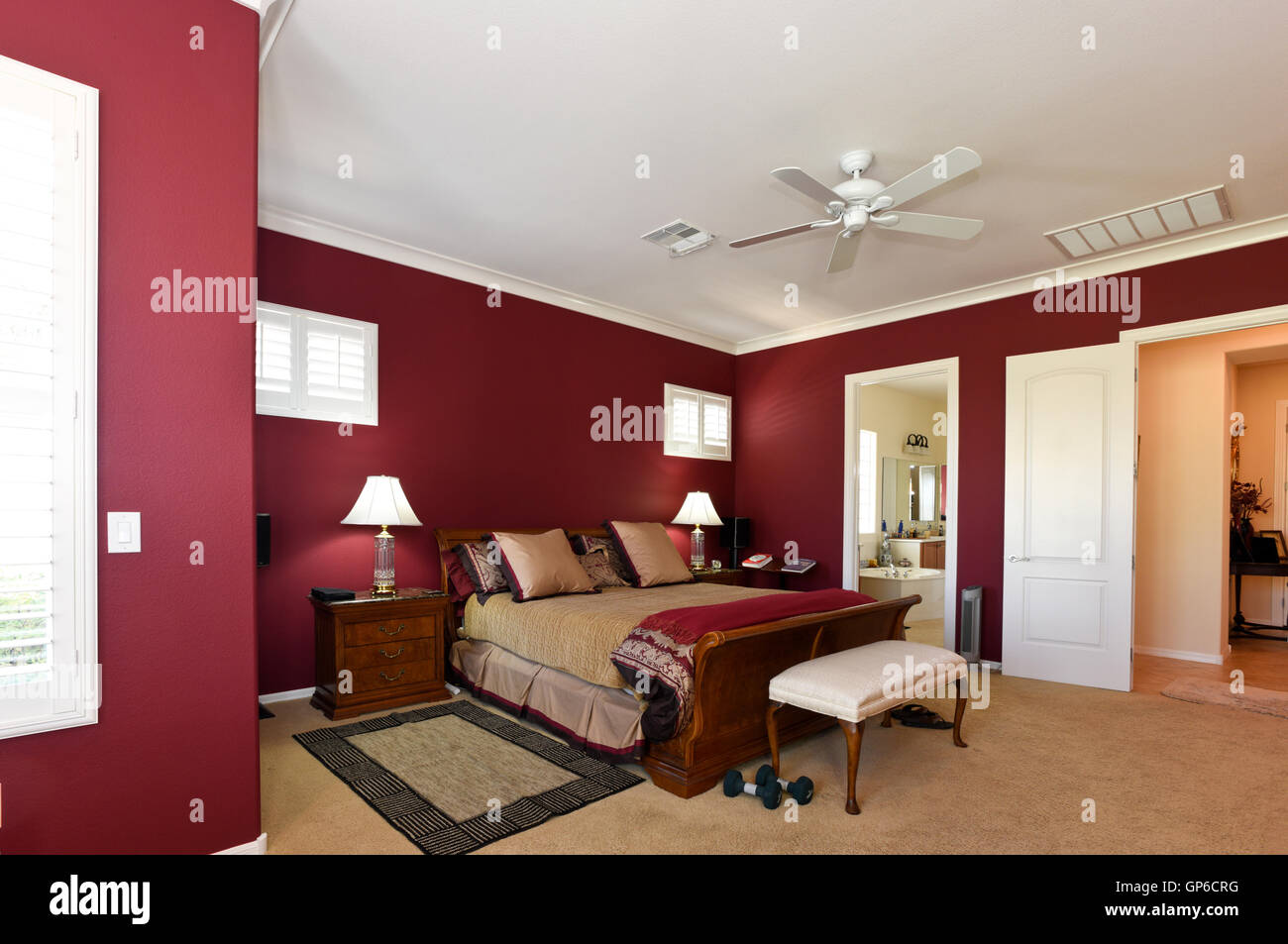 Residential interior master bedroom in red Stock Photo