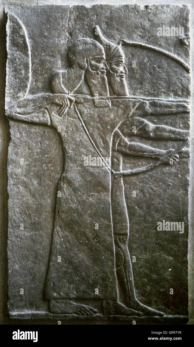 Assyrian. Palace of Sargon II of Dur-Sharrukin (actual Khorsabad). Relief of warriors. 8th century BC. Louvre Museum. Paris. France. Stock Photo
