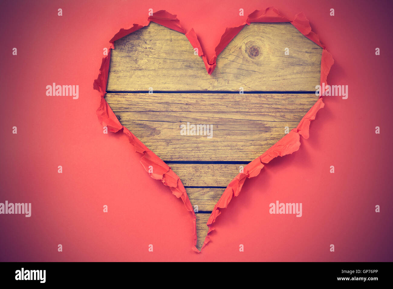 Wooden heart shape background on red frame Stock Photo - Alamy