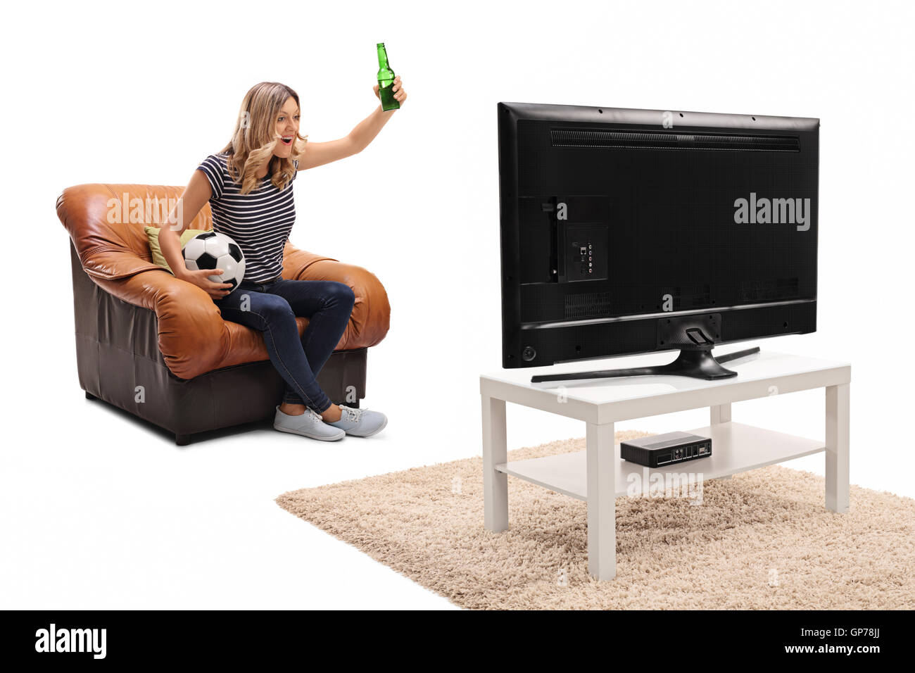 Excited woman watching football on tv and having a beer isolated on white background Stock Photo
