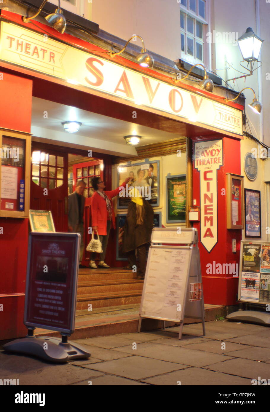 Theatre goers exit the Savoy Theatre and cinema in the town centre of Monmouth, Monmouthshire, Wales. Stock Photo