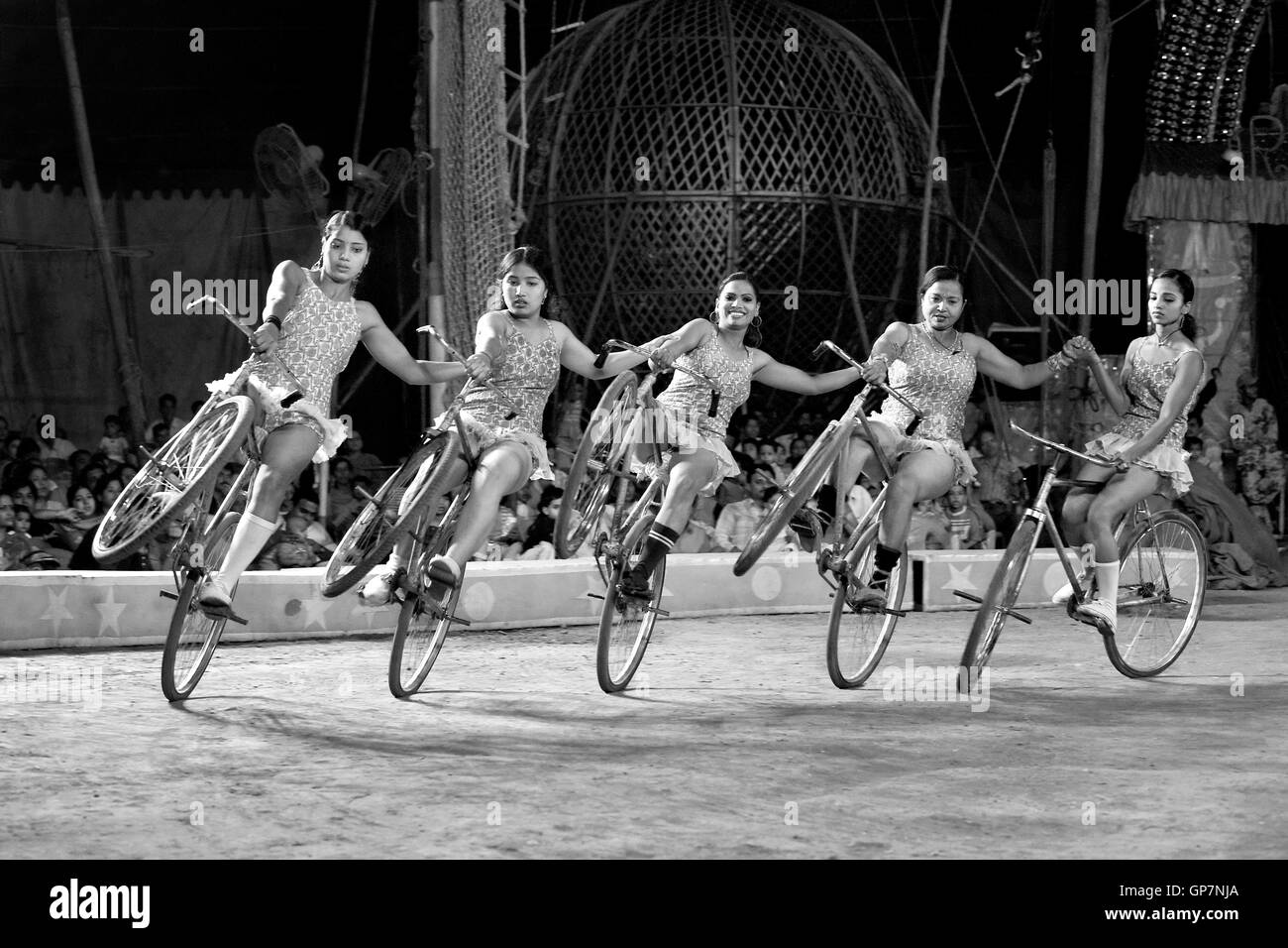 Women cycling in circus, india, asia Stock Photo