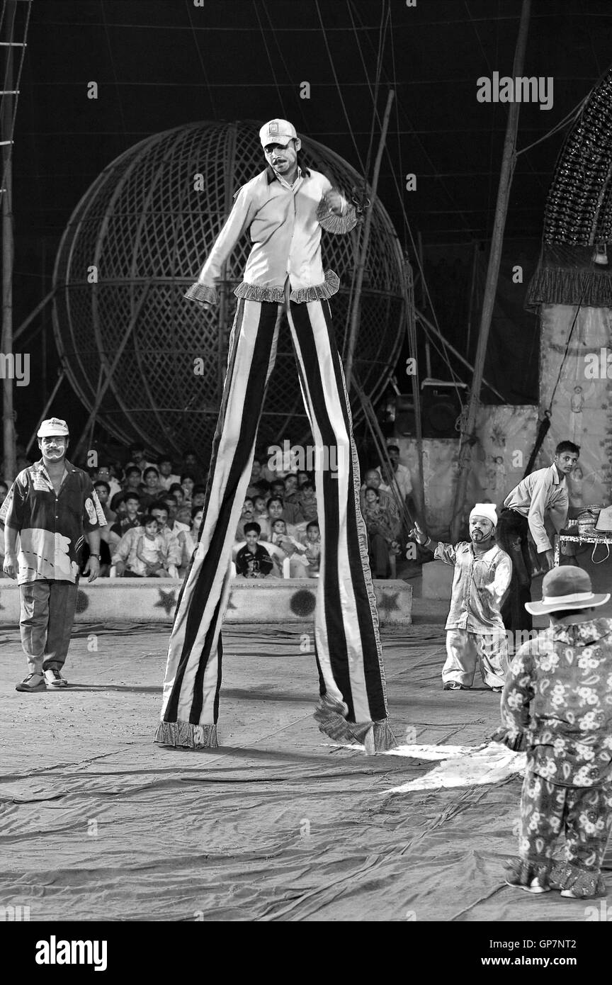 Man walking on stilts in circus, india, asia Stock Photo