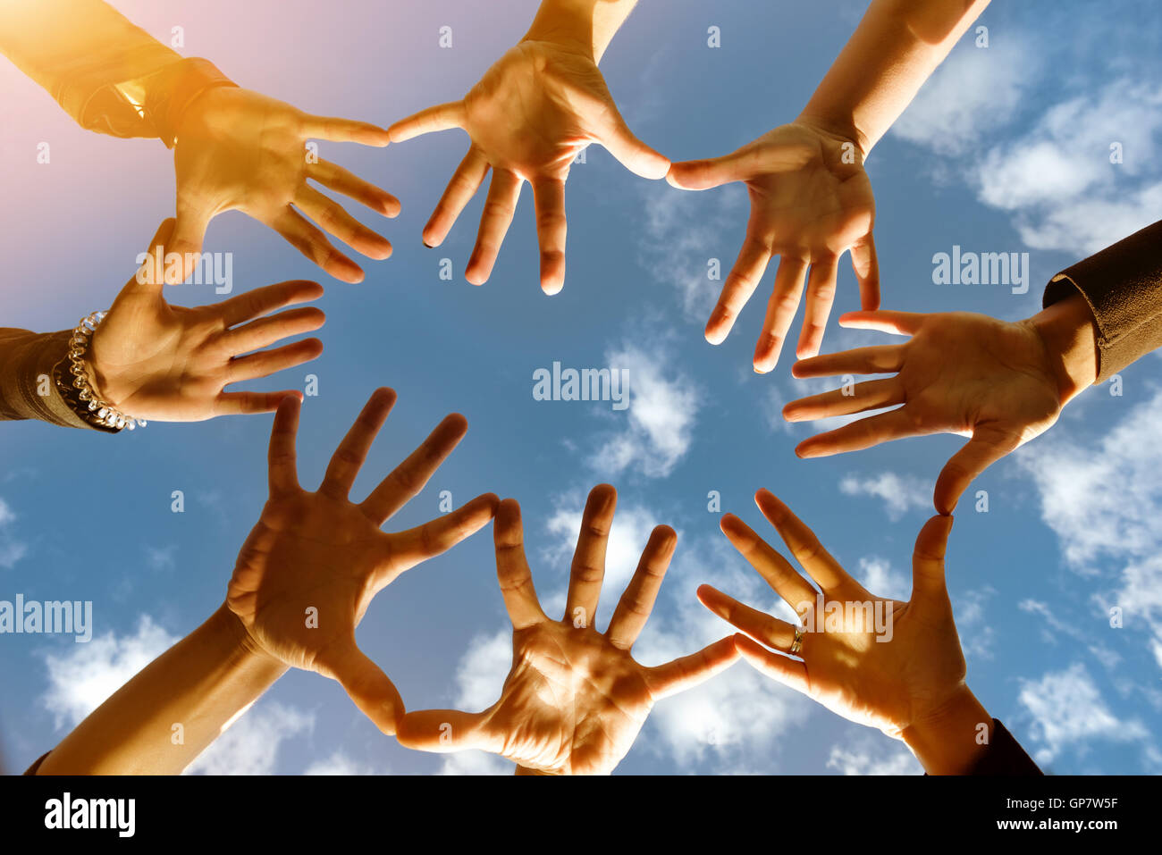 Friendsship team concept with many hands in circle Stock Photo