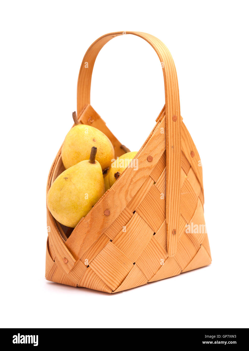 small birch bark basket full of small yellow pears isolated on white background Stock Photo
