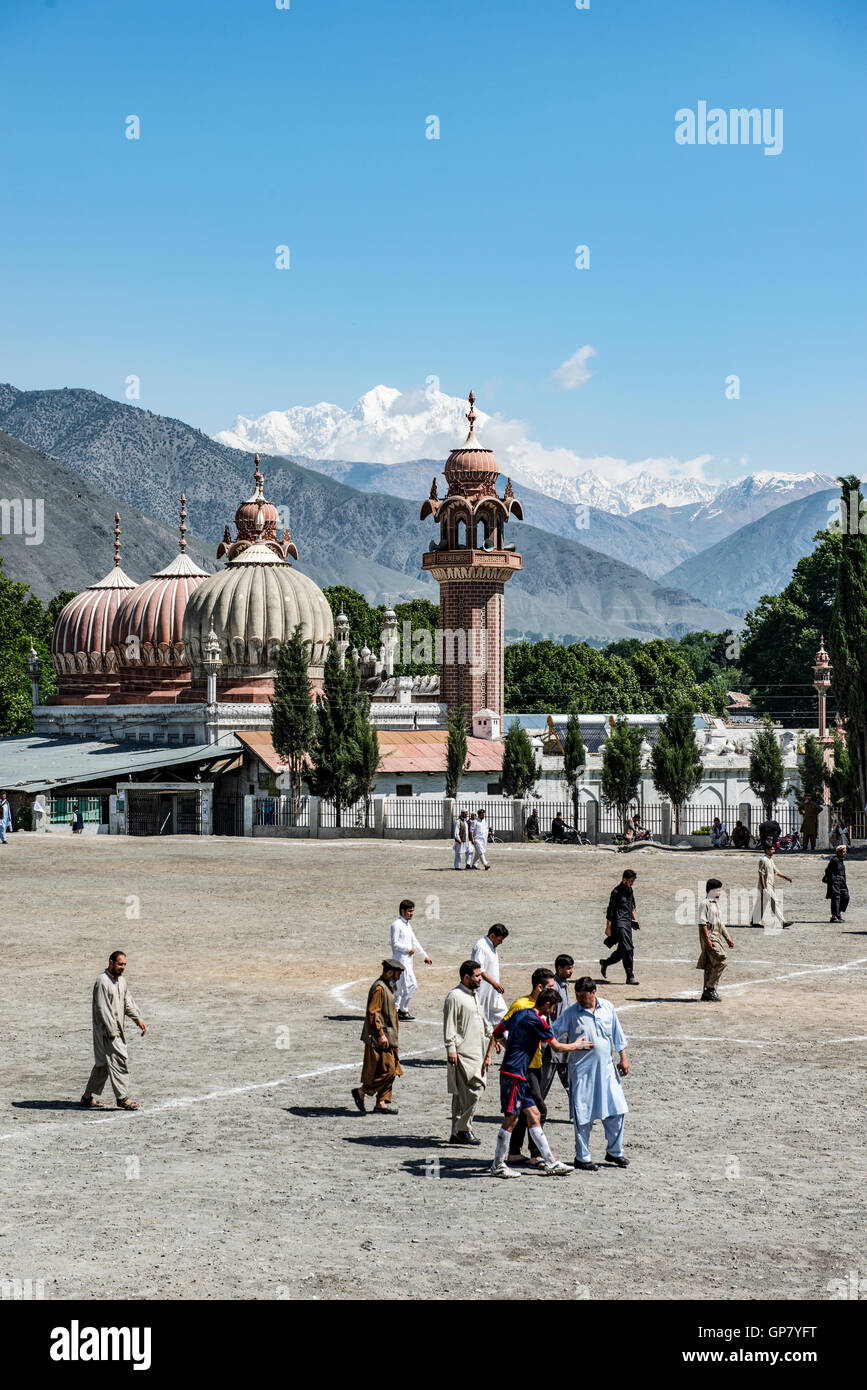 Shahi Masjid Chitral, built in 1924 by Shujah ul Mulk , then the Mehta of Chitral and Chitral football ground in the foreground Stock Photo