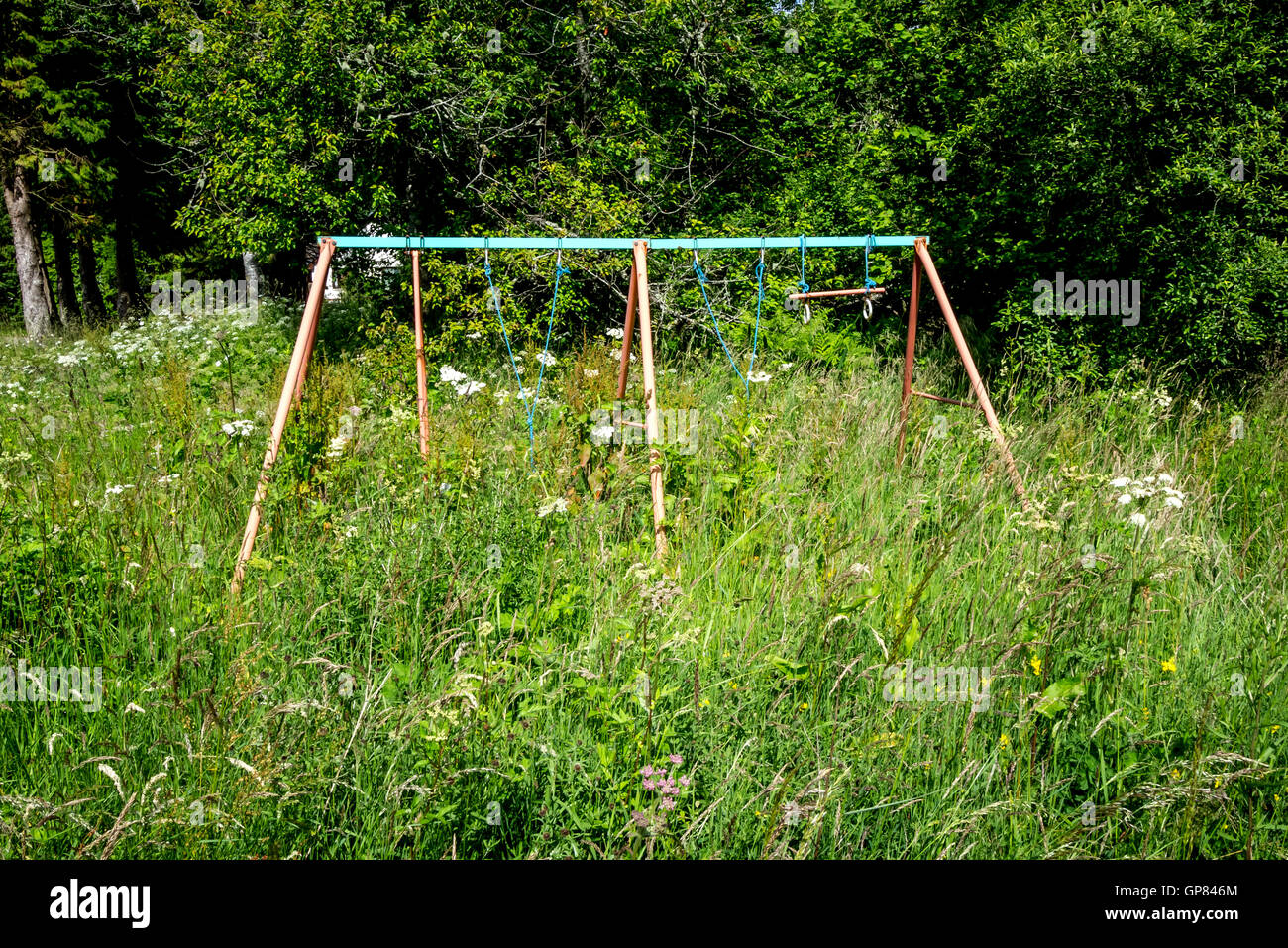 Nature reclaiming a playground at Inchree and Onich in Lochaber Stock Photo