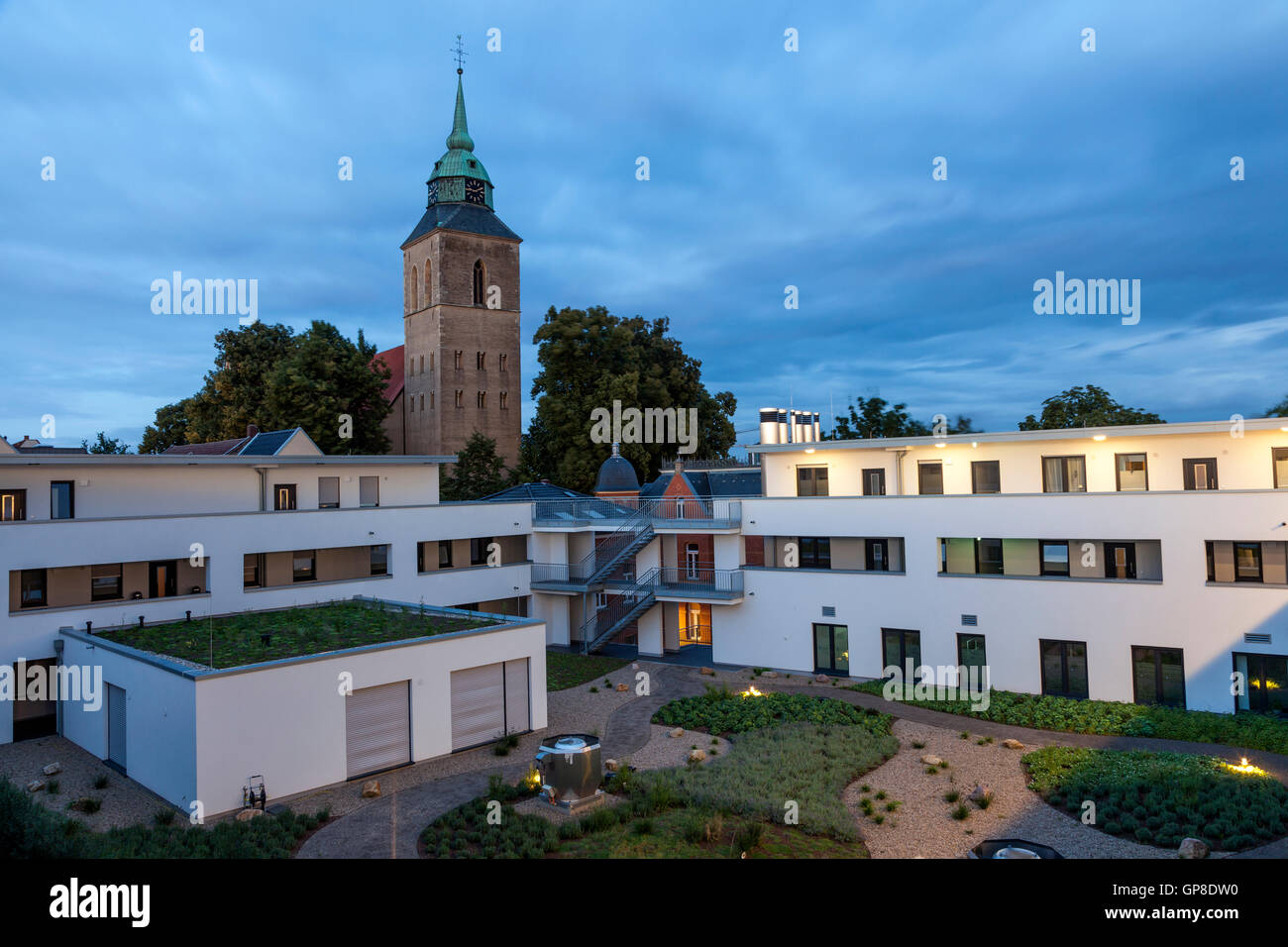 Apartment buildings and church Stock Photo