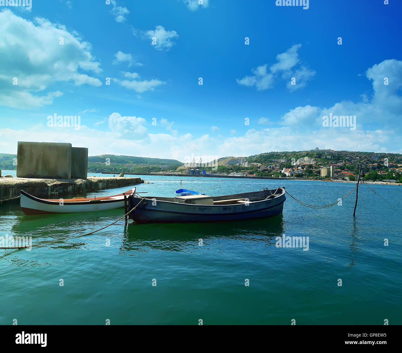 Floating boats in the sea near the pear at Balchik city, Bulgaria. Summer vacation background. Joy, happiness and recreation con Stock Photo