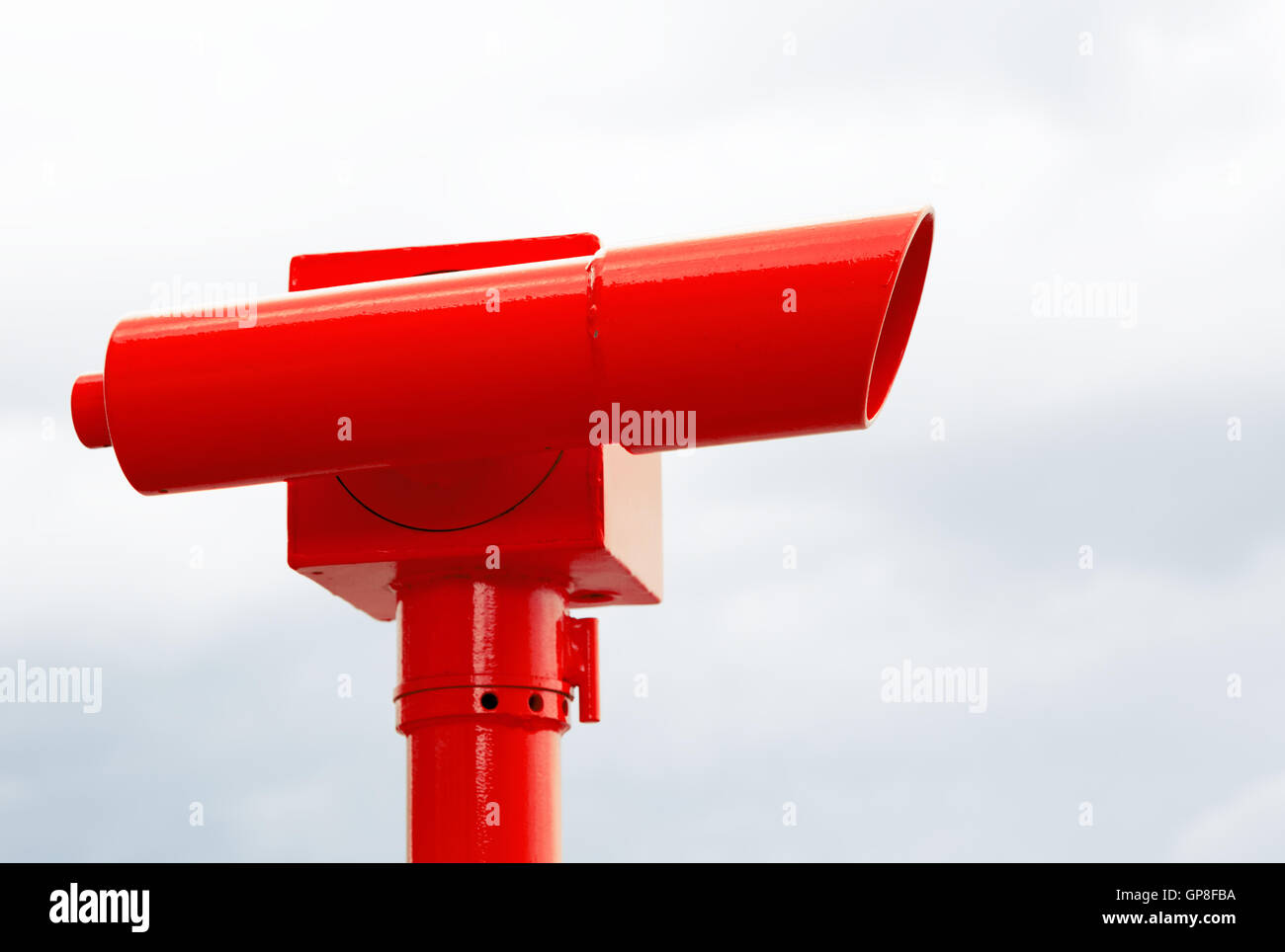 Bright red telescope used to view the ocean Stock Photo Alamy