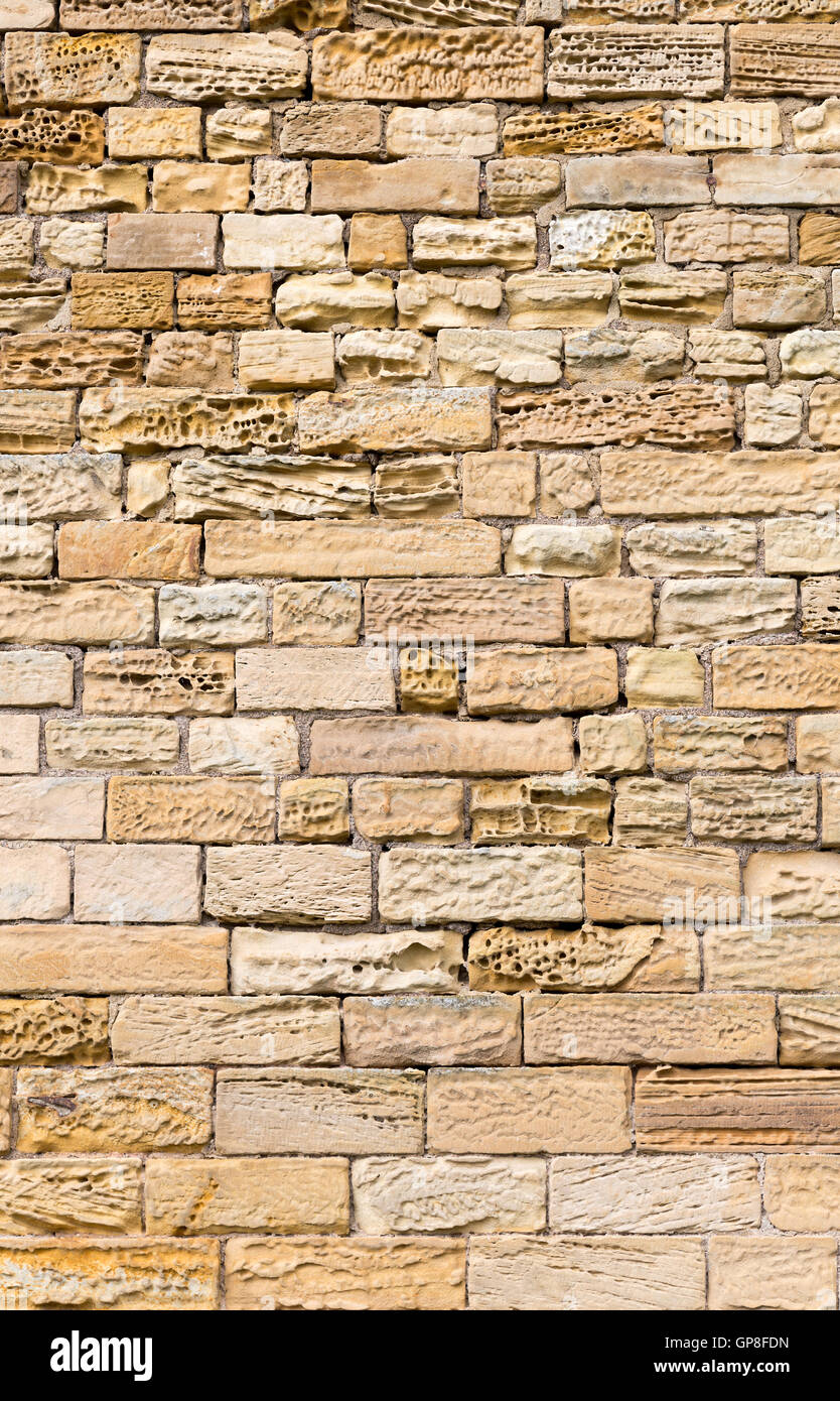 Eroded sandstone block wall Stock Photo