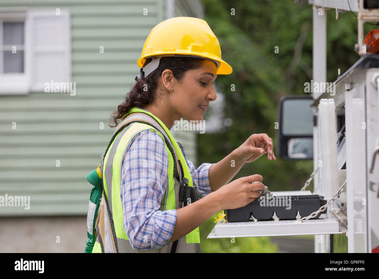 Hispanic female utility worker with tools at site Stock Photo Alamy