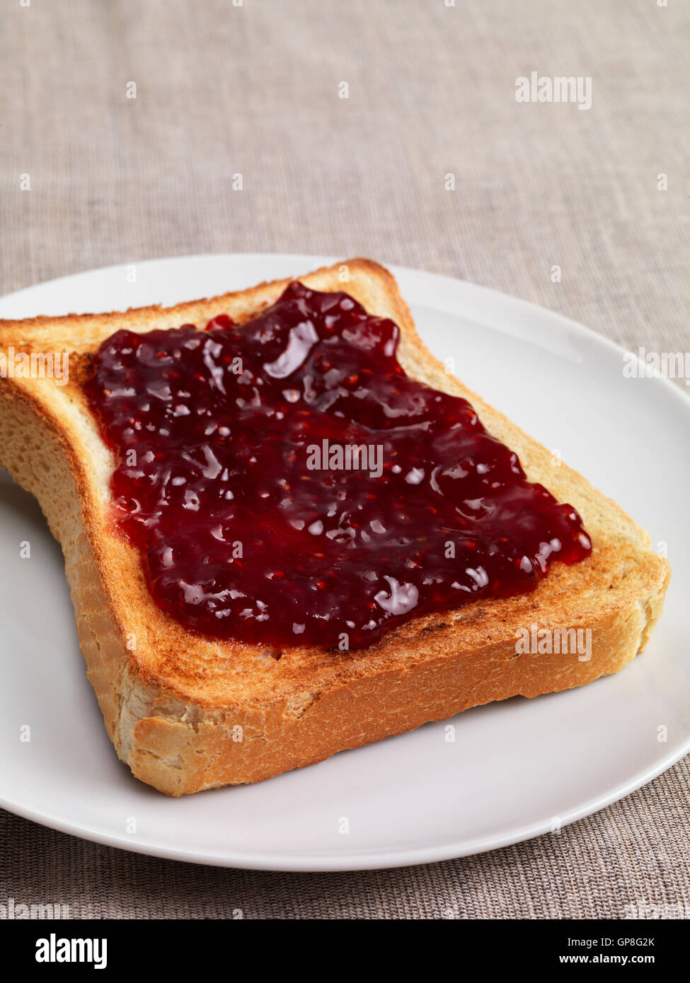 Toast with jam on plate Stock Photo Alamy