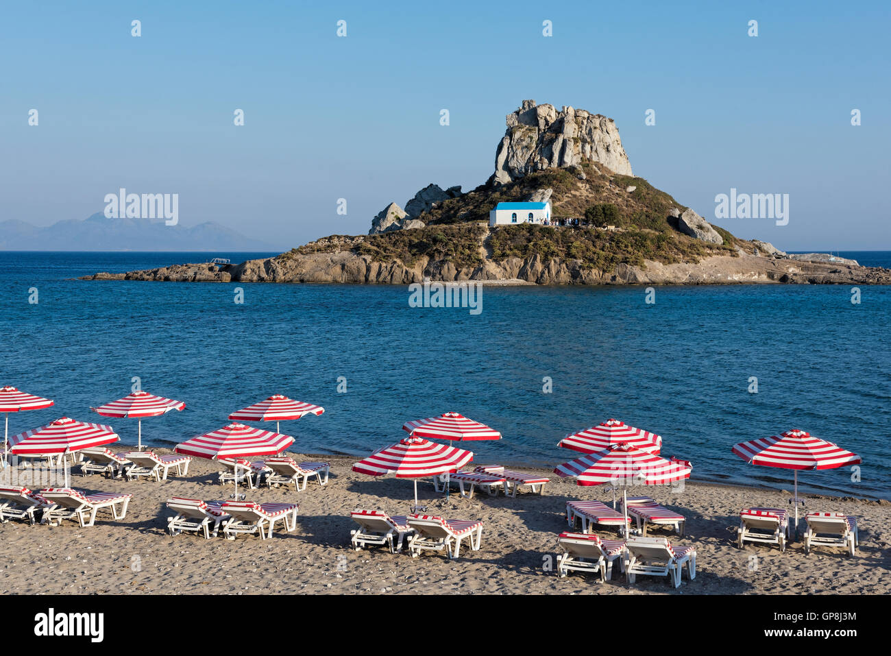 Landscape with sandy beach and islet in Kos island, Greece Stock Photo