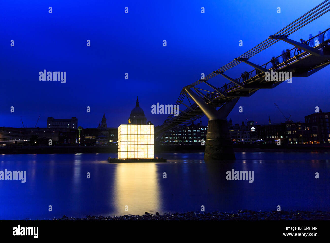 Floating Dreams installation by Korean artist Ik-Joong Kang, huge light cube floating in the river by the Millennium Bridge near St Paul's Cathedral, constructed from 500 miniature drawings and lit from inside, part of Totally Thames Festival, London Stock Photo