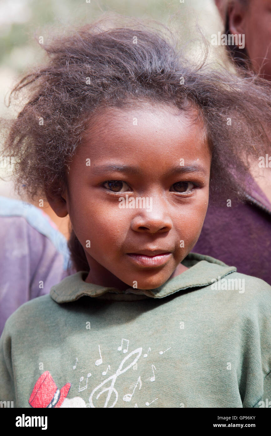 Very shy young girl at small village in Madagascar Stock Photo