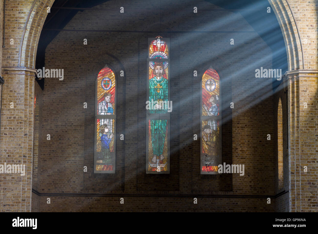 Sunlight illuminates the empty interior and lights up the stained glass