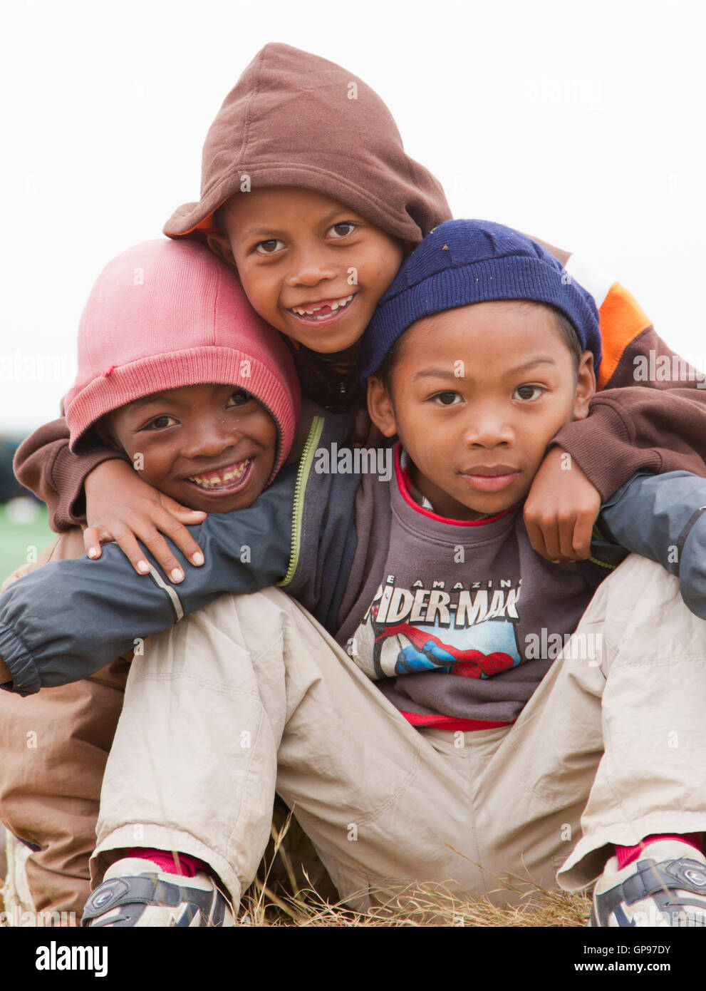 Group of three friends at farmers market, Madagascar Stock Photo