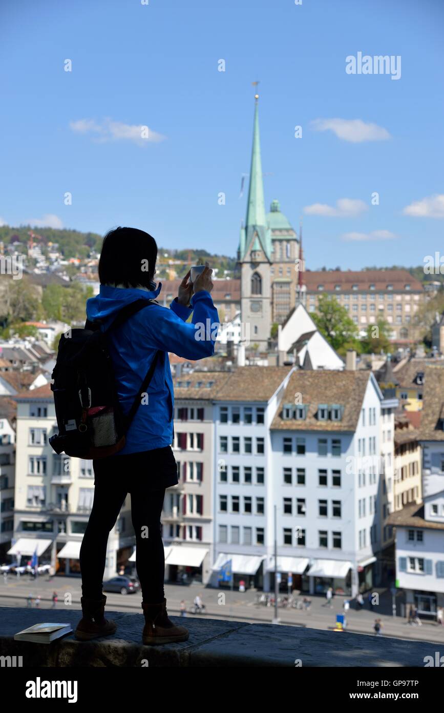 Tourist taking Pictures of Historic Center of Zürich, view from the Lindenhof, Zürich, Switzerland Stock Photo
