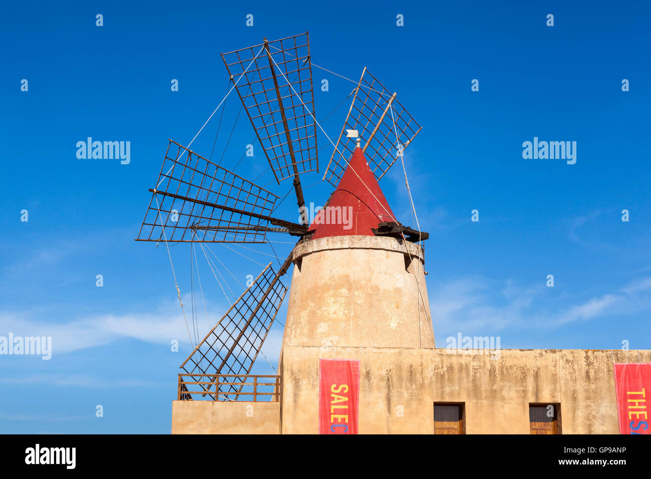 Salt Museum windmill at Stagnone salt pans, Stagnone, near Marsala and Trapani, Sicily, Italy Stock Photo