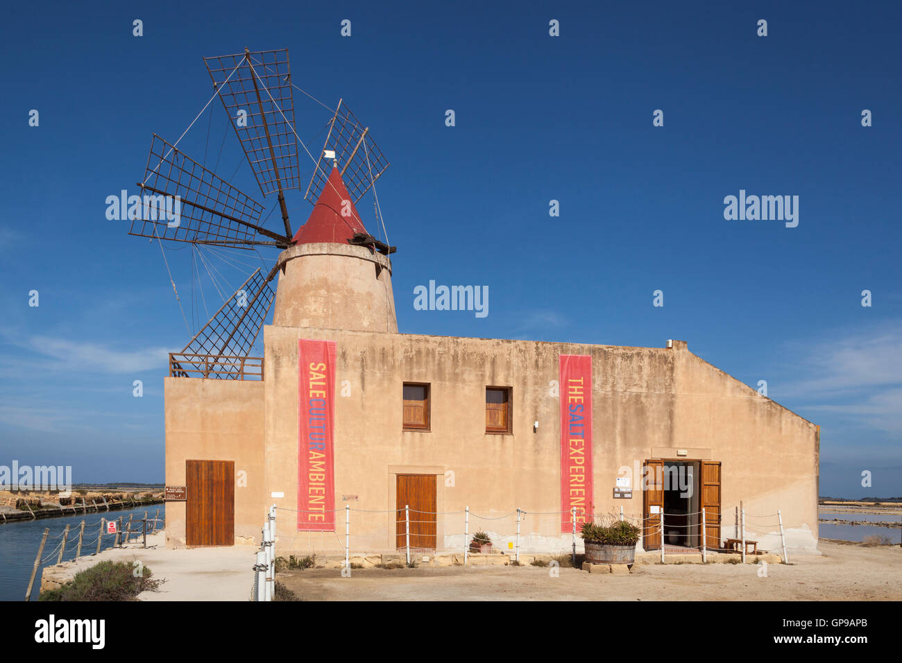 Salt Museum windmill at Stagnone salt pans, Stagnone, near Marsala and Trapani, Sicily, Italy Stock Photo