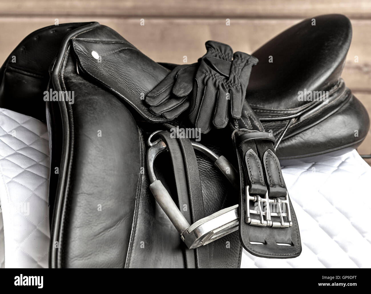 Used black dressage horse riding saddle with girth, stirrup and riding