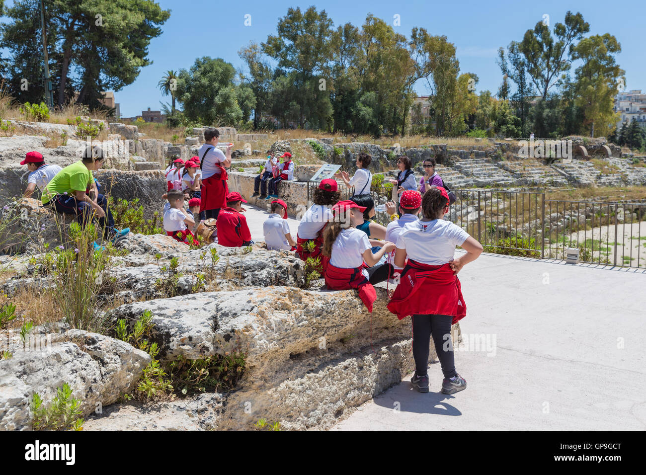 SIRACUSA ITALY - MAY 18: School pupils visiting the Greek theatre of Syracusa on May 18, 2016  at the island Sicily, Italy Stock Photo