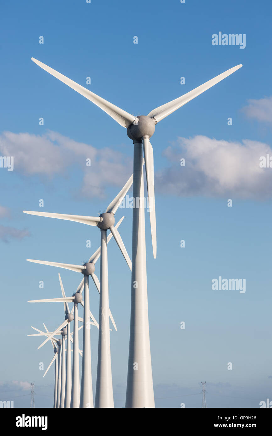 Row of large wind turbines and blue sky Stock Photo Alamy