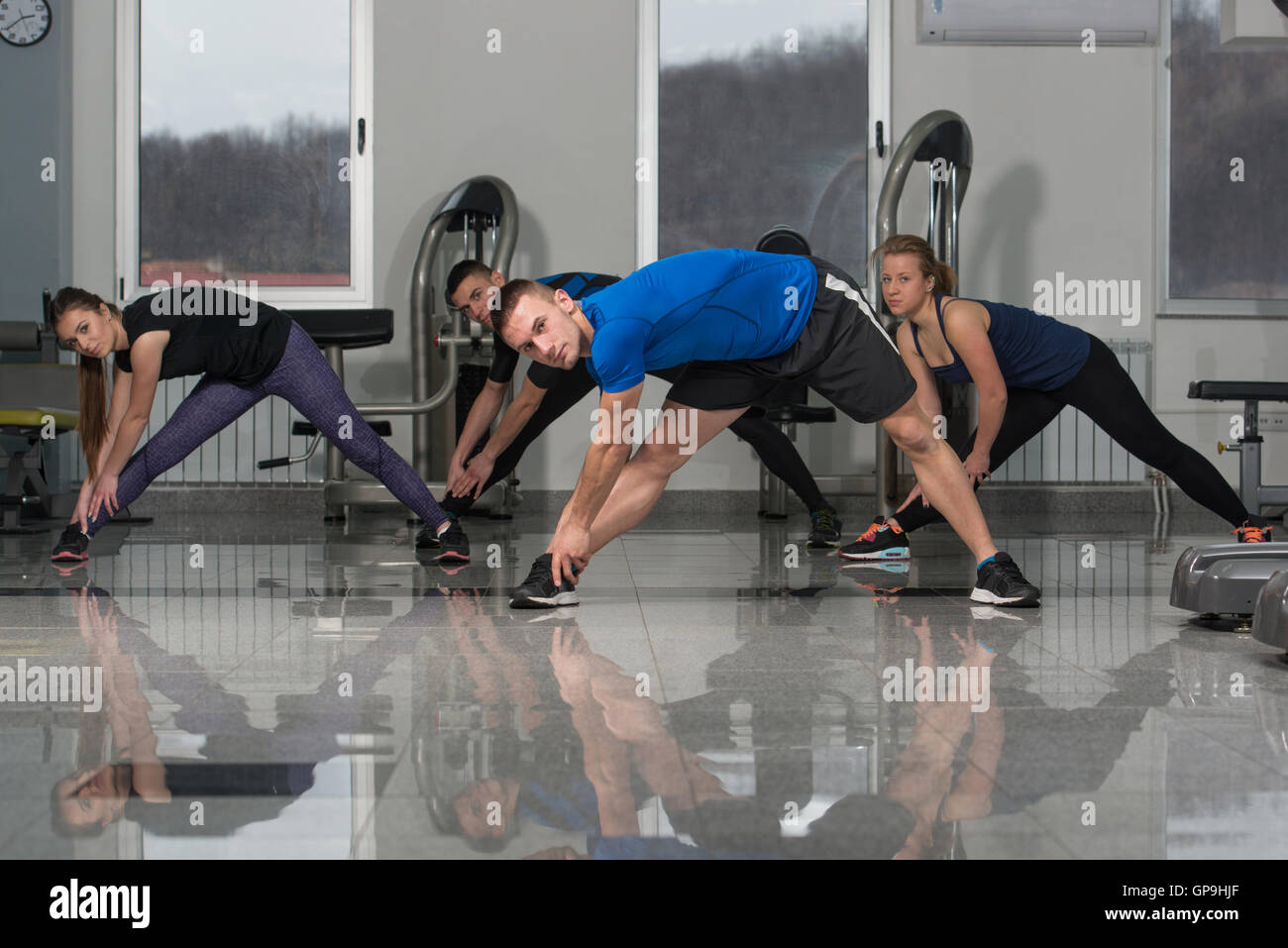 Group Of People At The Gym In A Stretching Class Stock Photo - Alamy