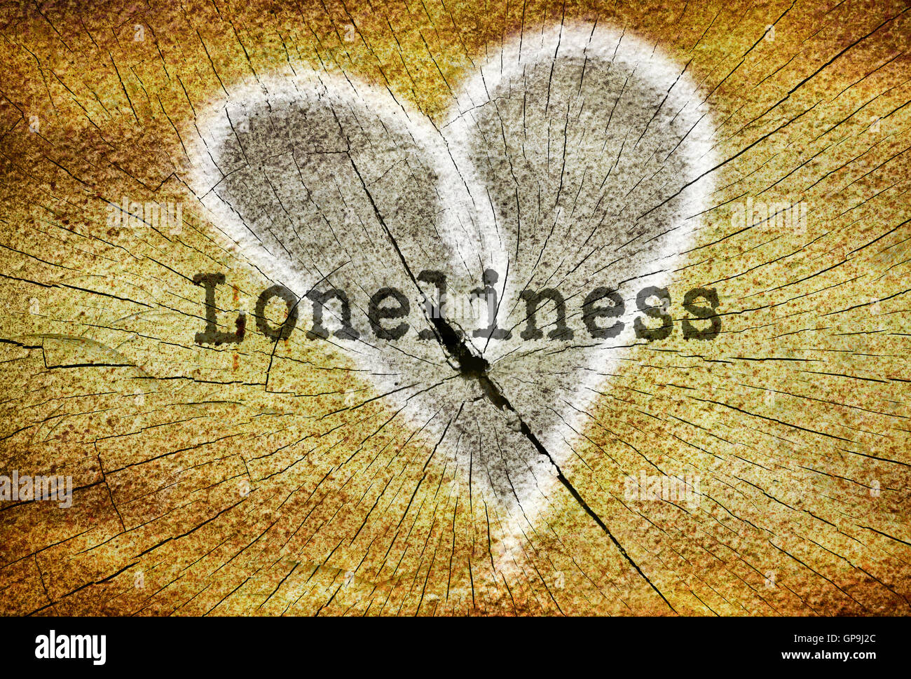 Word Loneliness written over drawn broken heart Stock Photo