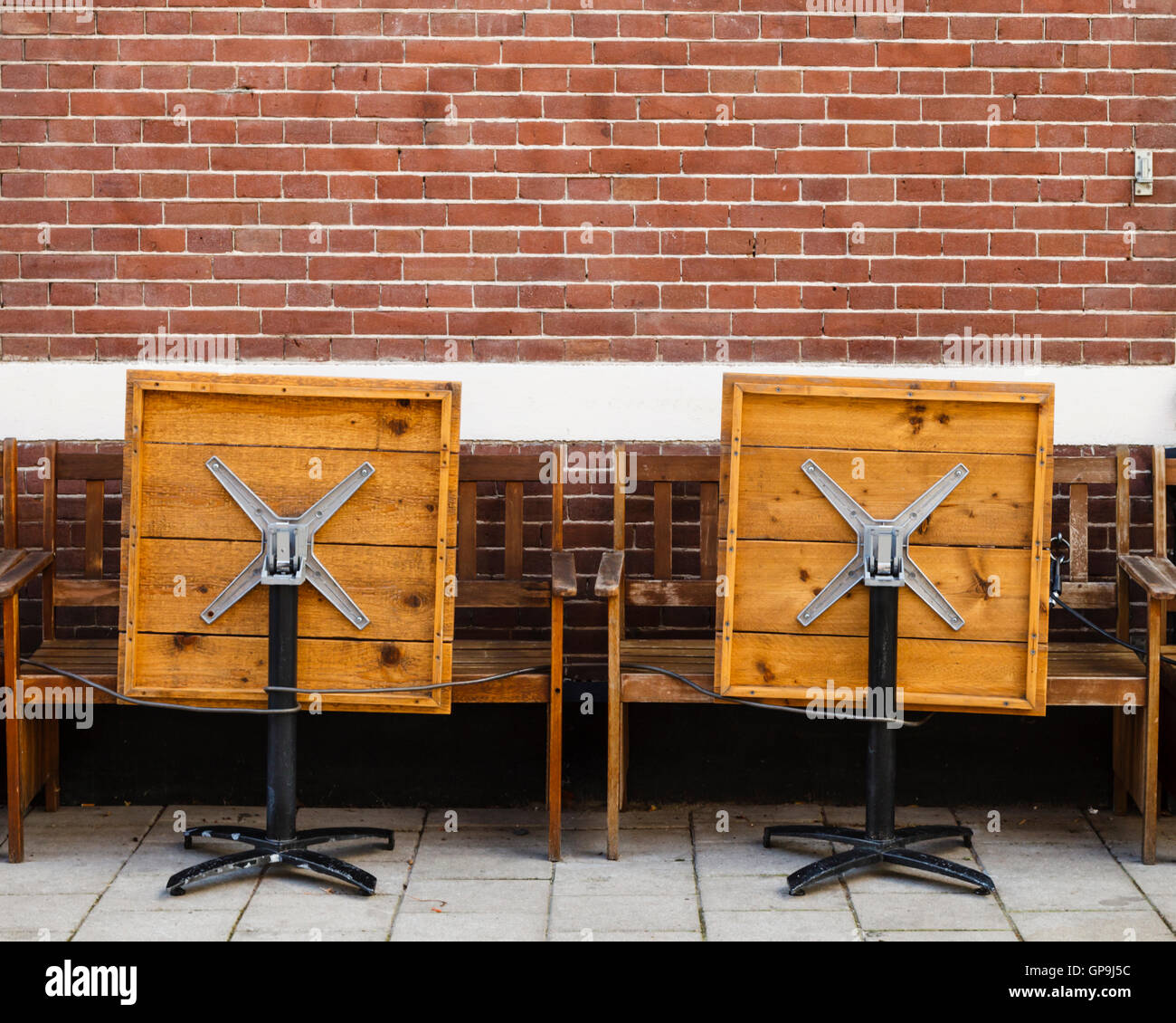 Cafe tables folded up for the night, Amsterdam Holland Netherlands