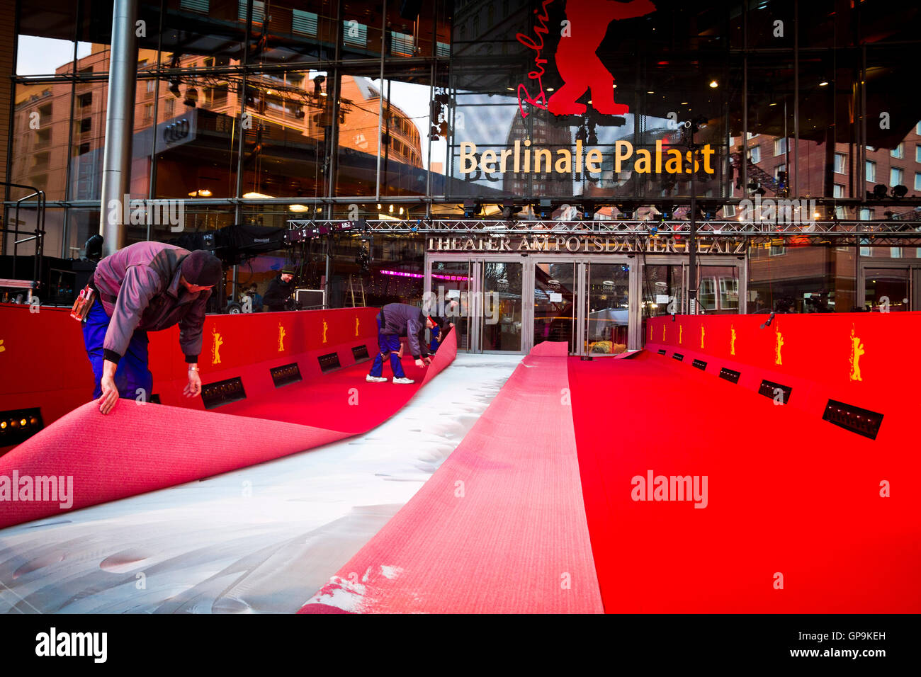 Workers securing the red carpet outside the Potsdamer Platz Theatre in Berlin, Germany. Stock Photo