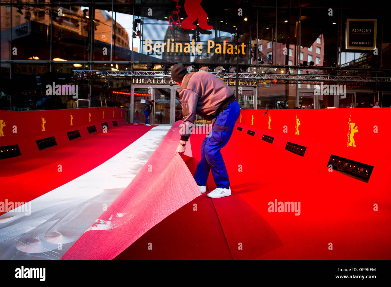 Workers securing the red carpet outside the Potsdamer Platz Theatre in Berlin, Germany. Stock Photo