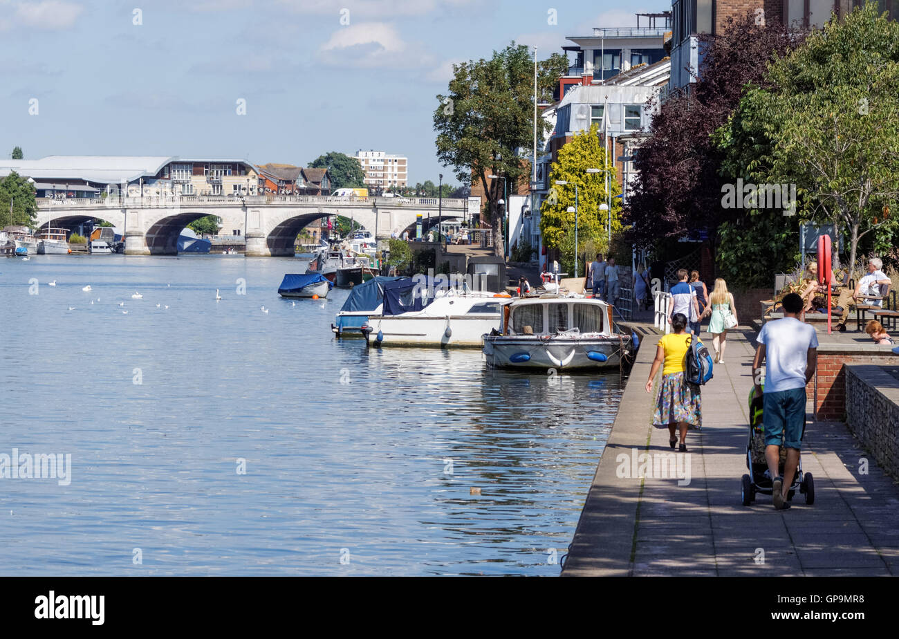 Thames riverside in Kingston upon Thames with Kingston Bridge in the